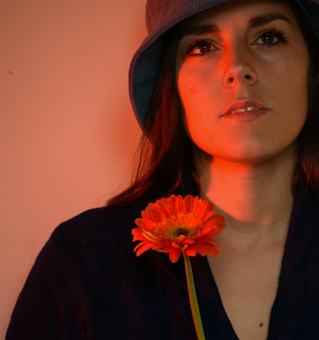 Studio portrait of a young Uruguayan woman reporter