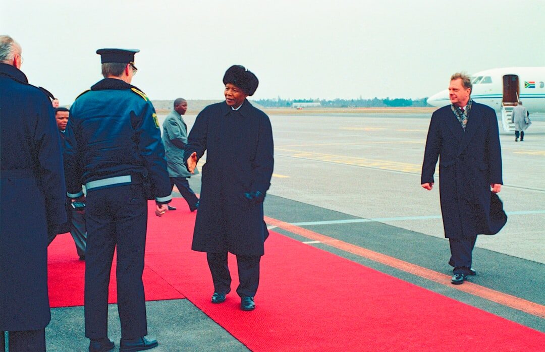 celebrities shaking hands on red carpet