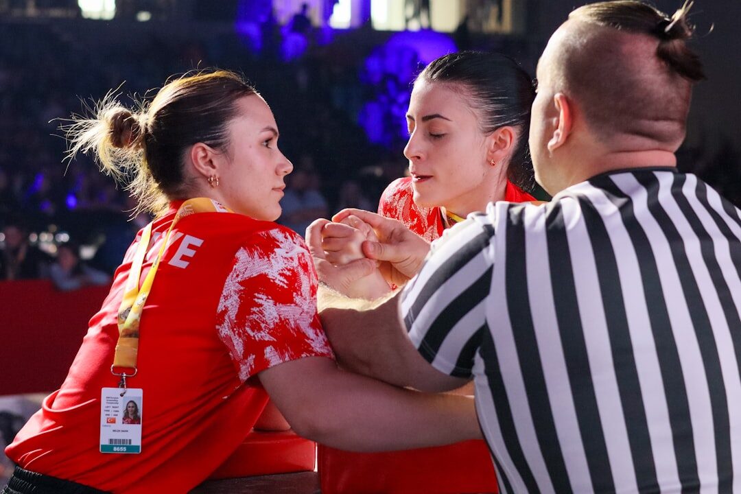 two celebrities shaking hands at event