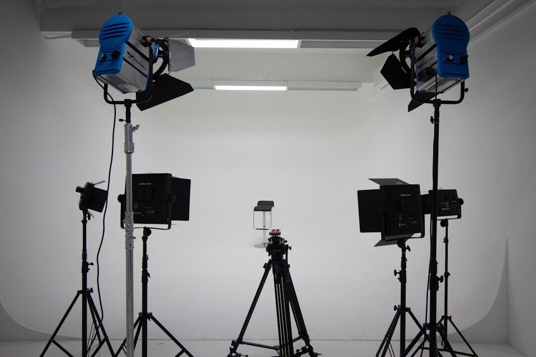 Television studio set with bright stage lights and cameras
